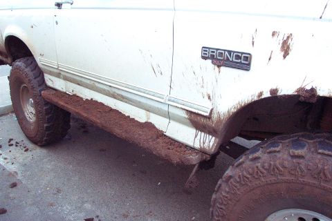 1996 Ford Bronco - Used the new rock sliders against the wall going through an off camber trun in the obsacle course. (3/6/2004)
