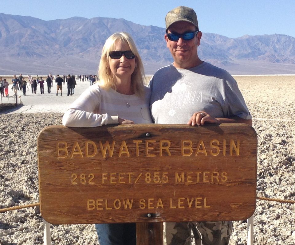 Couple posing at Badwater Basin sign