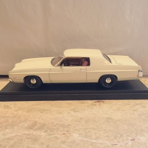 2004 Ford Crown Victoria - Model car on display base, side view.