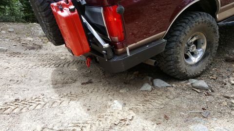1996 Ford Bronco - Rear view of a 1996 Ford Bronco equipped for off-road with a spare tire and jerry can.