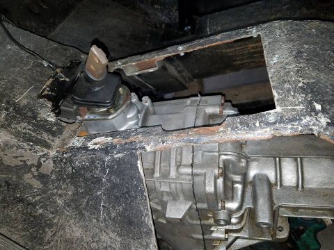 1972 Ford Bronco - Close-up of the transmission and transfer case components visible from underneath the vehicle.