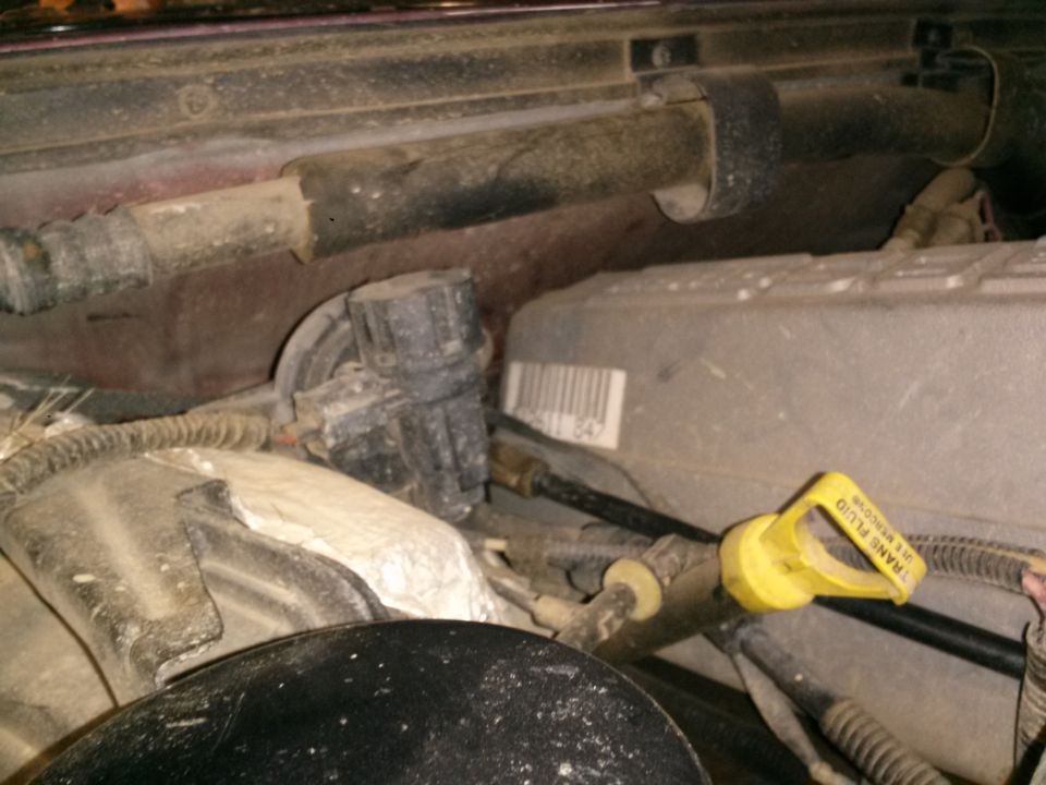1996 Ford Bronco engine bay with transmission fluid dipstick.