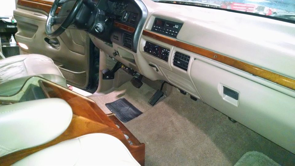Interior shot of a truck's dashboard and seats