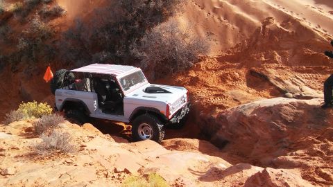 1979 Ford Bronco - This 1979 Ford Bronco navigates a challenging off-road course with its distinctive American flag-patterned roof.