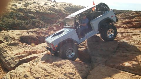 1979 Ford Bronco - This modified 1979 Ford Bronco navigates a challenging rocky trail, its off-road capabilities.