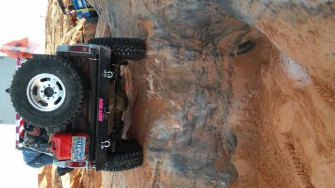 1979 Ford Bronco - Off-roading adventure captured with a 1979 Ford Bronco navigating a challenging rocky path.