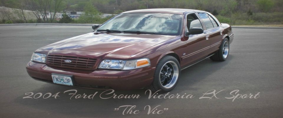 2004 Ford Crown Victoria LX Sport sedan, maroon paint, aftermarket wheels