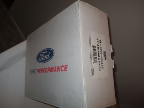2004 Ford Crown Victoria - A white box with Ford Performance branding contains a differential gear set.
