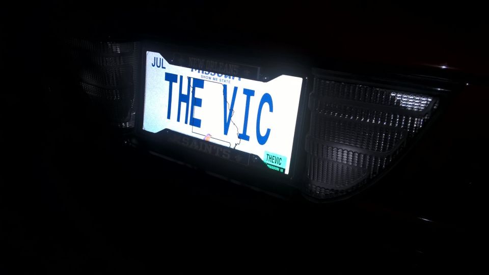License plate reading "THE VIC" on a dark vehicle
