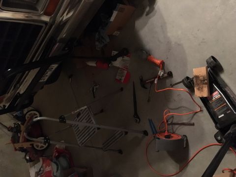 1978 Ford Bronco - The rear of a 1978 Ford Bronco is visible, surrounded by various tools and equipment.