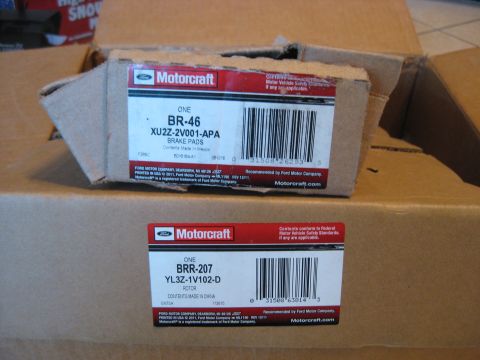 1994 Ford Bronco - Boxes of Motorcraft brake pads and a rotor are shown, with part numbers BR-46 and BRR-207 visible.