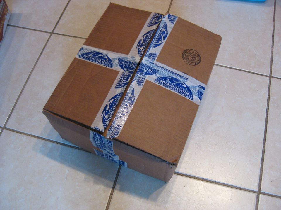 Cardboard box sealed with RockAuto.com tape
