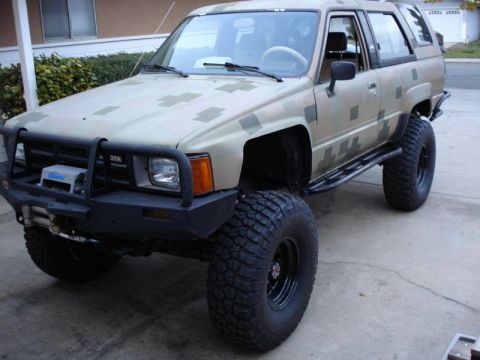 1989 Ford Bronco - This modified Toyota 4Runner features camouflage paint and off-road upgrades.