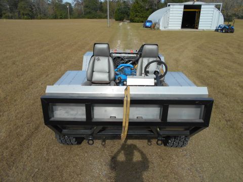 1992 Ford Bronco - This custom-built amphibious vehicle has a unique design with two seats and an open-air cargo area.