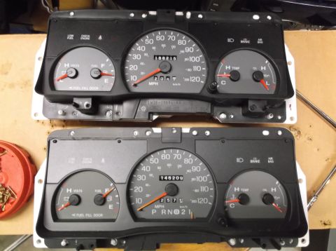 1999 Mercury Grand Marquis - Two car dashboard instrument clusters are shown, possibly for replacement or comparison.