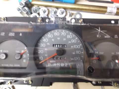 1999 Mercury Grand Marquis - Close-up of a car's instrument cluster, showing the speedometer and other gauges.