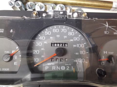 1999 Mercury Grand Marquis - Close-up of a car's instrument cluster, displaying speed, mileage, and fuel level.
