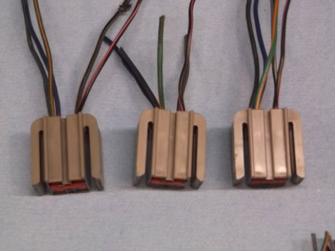 1999 Mercury Grand Marquis - Three tan wiring harness connectors with multiple colored wires are shown.