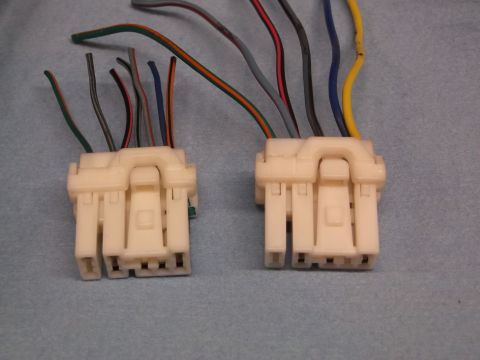 1999 Mercury Grand Marquis - Close-up of two automotive wiring harness connectors with various colored wires.