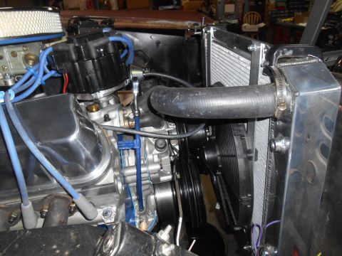 1972 Ford Bronco - Close-up of a V8 engine bay with chrome accents and a large radiator fan.