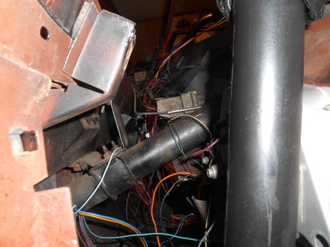 1972 Ford Bronco - Close-up view of a vehicle's interior wiring and steering column assembly.