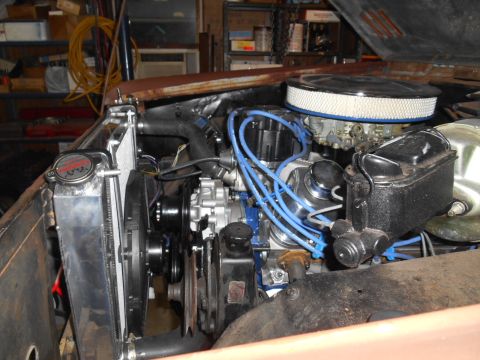 1972 Ford Bronco - Close-up of a V8 engine bay, an aftermarket radiator and air cleaner assembly.