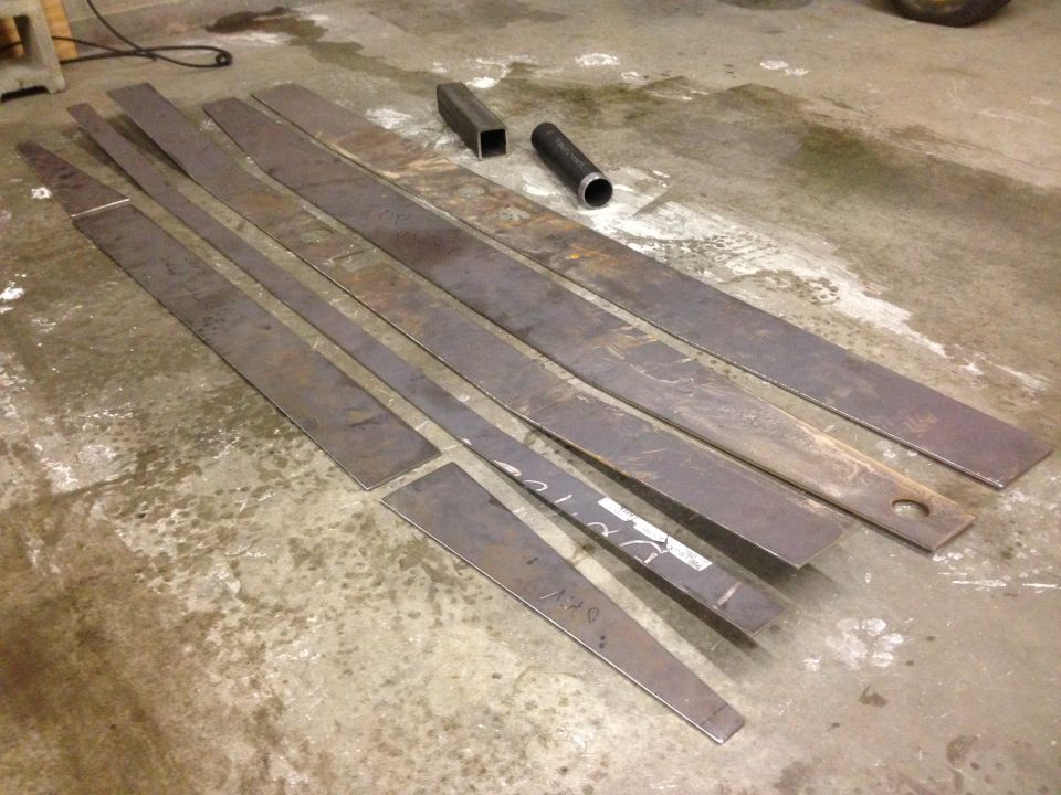 Cut metal pieces on a concrete floor.
