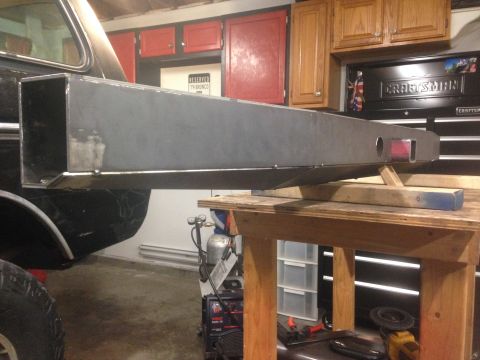 1979 Ford Bronco - A custom fabricated steel bumper, likely for a 1979 Ford Bronco, is shown mounted to the rear of a vehicle. The bumper is a rectangular box…