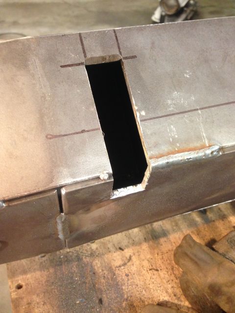 1979 Ford Bronco - A close-up view of a metal object with a rectangular cutout. The metal appears to be part of a fabricated structure, possibly a vehicle fra…