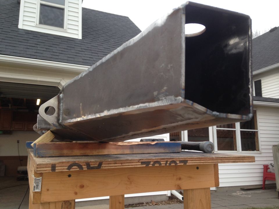 Fabricated steel tube on a workbench.
