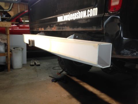 1979 Ford Bronco - A custom rectangular bumper is mounted to the rear of a black Ford pickup truck. A white sticker with text is visible on the truck's tailga…