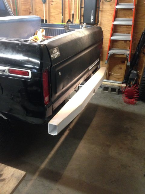 1979 Ford Bronco - The rear passenger side of a black 1979 Ford Bronco is shown with a custom-built, unfinished square tube rear bumper installed. The vehicle…