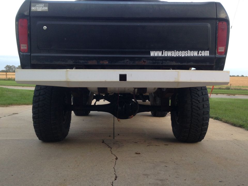 1979 Ford Bronco rear view, showing black tailgate, white bumper, and large tires