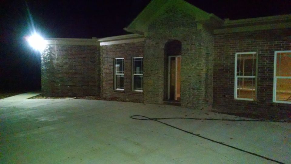 That's the exit motion LED above the walkway to my parking spots, and the master patio.  The porch light in the arch isn't on.