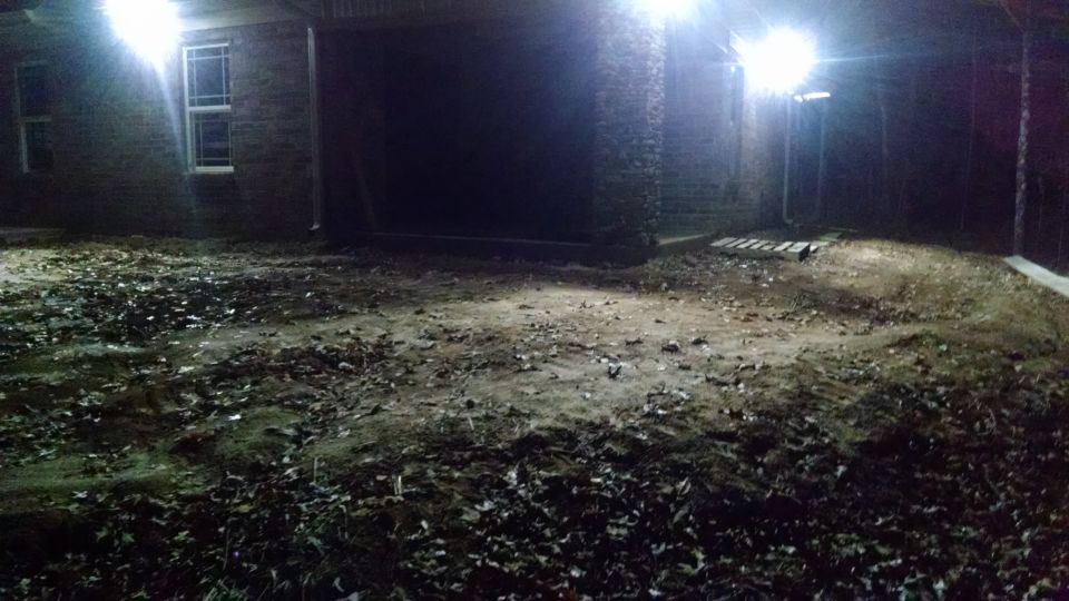 These floods light the area around the utility porch (where the riding mower will be parked).  The porch itself has a pair of 4-foot LEDs, like those in the garage.