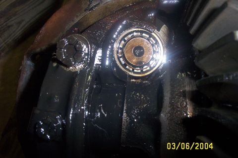 1979 Ford F-150 - Close-up of a greasy differential gear and bearing, showing mechanical components with a visible date stamp.