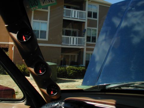 1988 Ford Bronco - A-pillar gauge pod with three gauges is visible inside the vehicle.