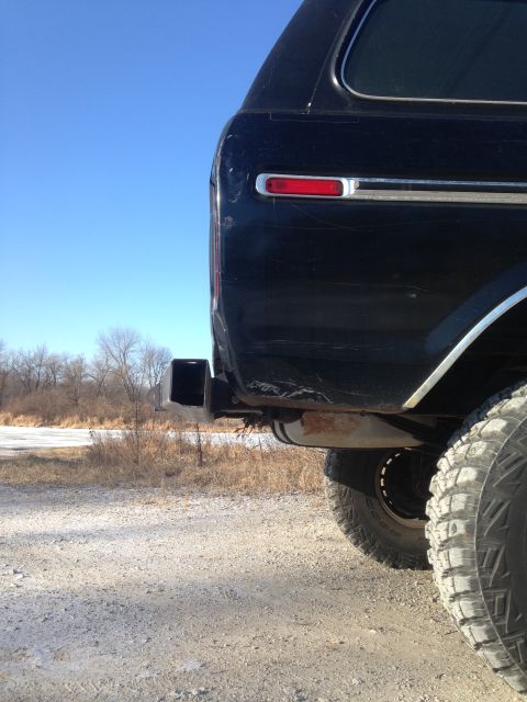 1979 Ford Bronco - Black 1978 Ford Bronco rear view, showing the quarter panel, taillight, and trailer hitch receiver.
