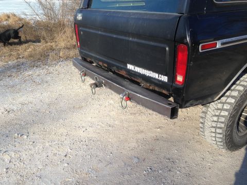 1979 Ford Bronco - A custom fabricated steel bumper with multiple tow points is attached to the rear of a black SUV.
