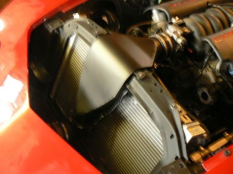 1976 Chevrolet Corvette - Engine bay components including radiator and intake manifold are visible in this close-up shot.