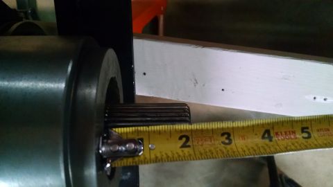 1985 Jeep CJ7 - A splined shaft is measured, with a yellow tape measure showing markings from 1 to 5 inches.