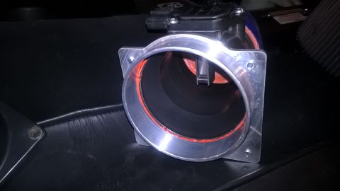2004 Ford Crown Victoria - A mass air flow sensor is shown with an orange gasket and black interior.