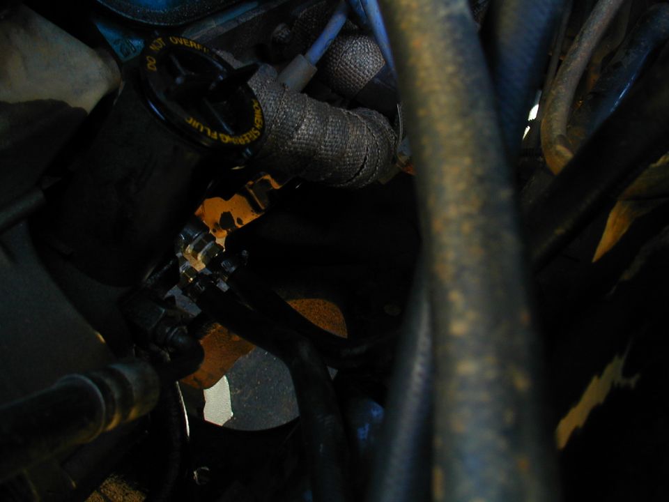Engine bay hoses and metal components, some with heat wrap