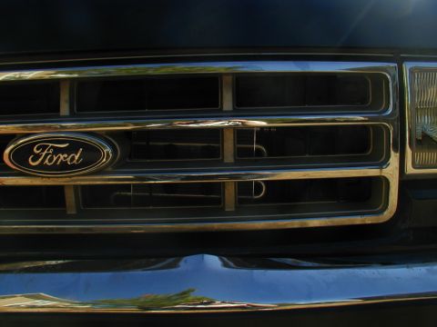 1988 Ford Bronco - Front grille detail of a Ford F-Series truck, likely from the early 1990s.