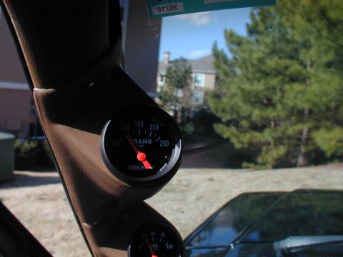 1988 Ford Bronco - Interior view of dashboard gauges, including a transmission temperature gauge, mounted on the A-pillar.