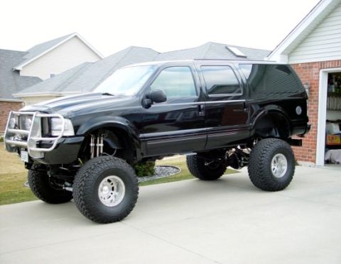 2001 Ford Excursion - This black 2001 Ford Excursion is modified with a lift kit and oversized tires.