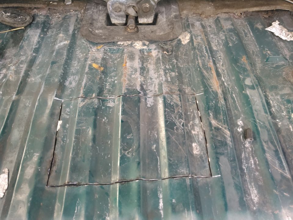 i looked at the floor for the line of spot welds. this is where a crossmember is to hold the floor. i started cutting alittl away form the spot welds hoping to miss the crossmember. i then cut about a foot wide. i cut about 8 inches back which is enough to get the pump out but a couple more inches would make it easier.

i used a sawzaw with a blade i cut shorter to prevent hitting the tank. i tried to be extra carefull not to hit the electrical or fuel hoses. remember there is also a vent hose which i almost hit