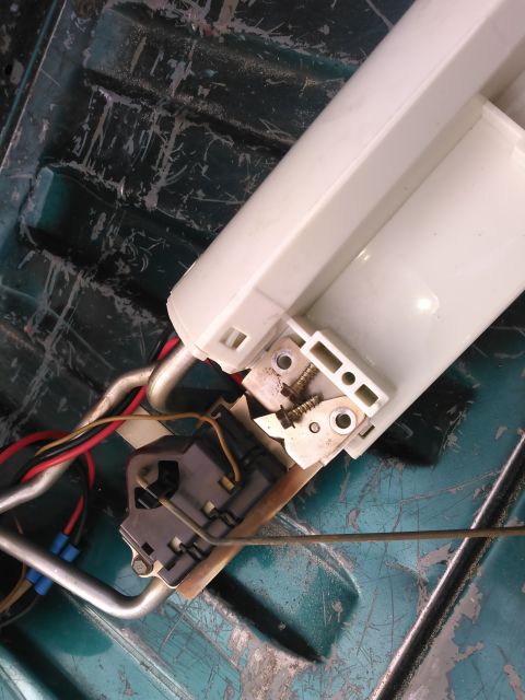 1996 Ford Bronco - remove these 2 screwes. the pump is locked in by a lock ring around 1 of the tubes