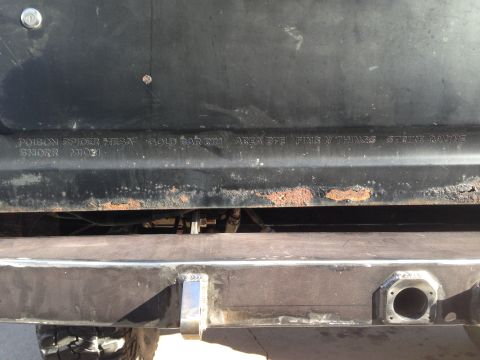 1979 Ford Bronco - Embossed text on a vehicle panel shows 'POISON SPIDER MESA GOLD BAR RIM AREA 075 PINS N THINGS STRING RAVINE'.