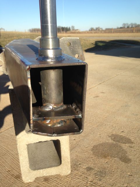1979 Ford Bronco - A close-up view of a custom-fabricated metal component, possibly for a vehicle, is shown outdoors.